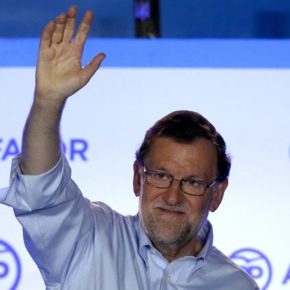 Spain's acting Primer Minister and candidate of Popular Party Mariano Rajoy, waves to his supporters as he celebrates the results of the party during the national elections in Madrid, Spain, Sunday, June 26, 2016. Spain's repeat election on Sunday failed to clarify the political future of the European Union's fifth-largest economy, with the main parties placing roughly the same as in last December's ballot, which brought six months of stalemate. (AP Photo/Daniel Ochoa de Olza)